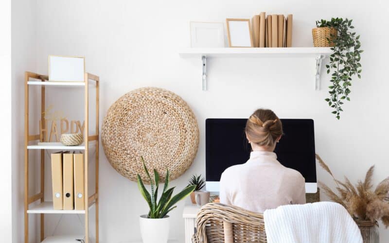 Young,Woman,Sitting,At,Workplace,In,Office,,Back,View